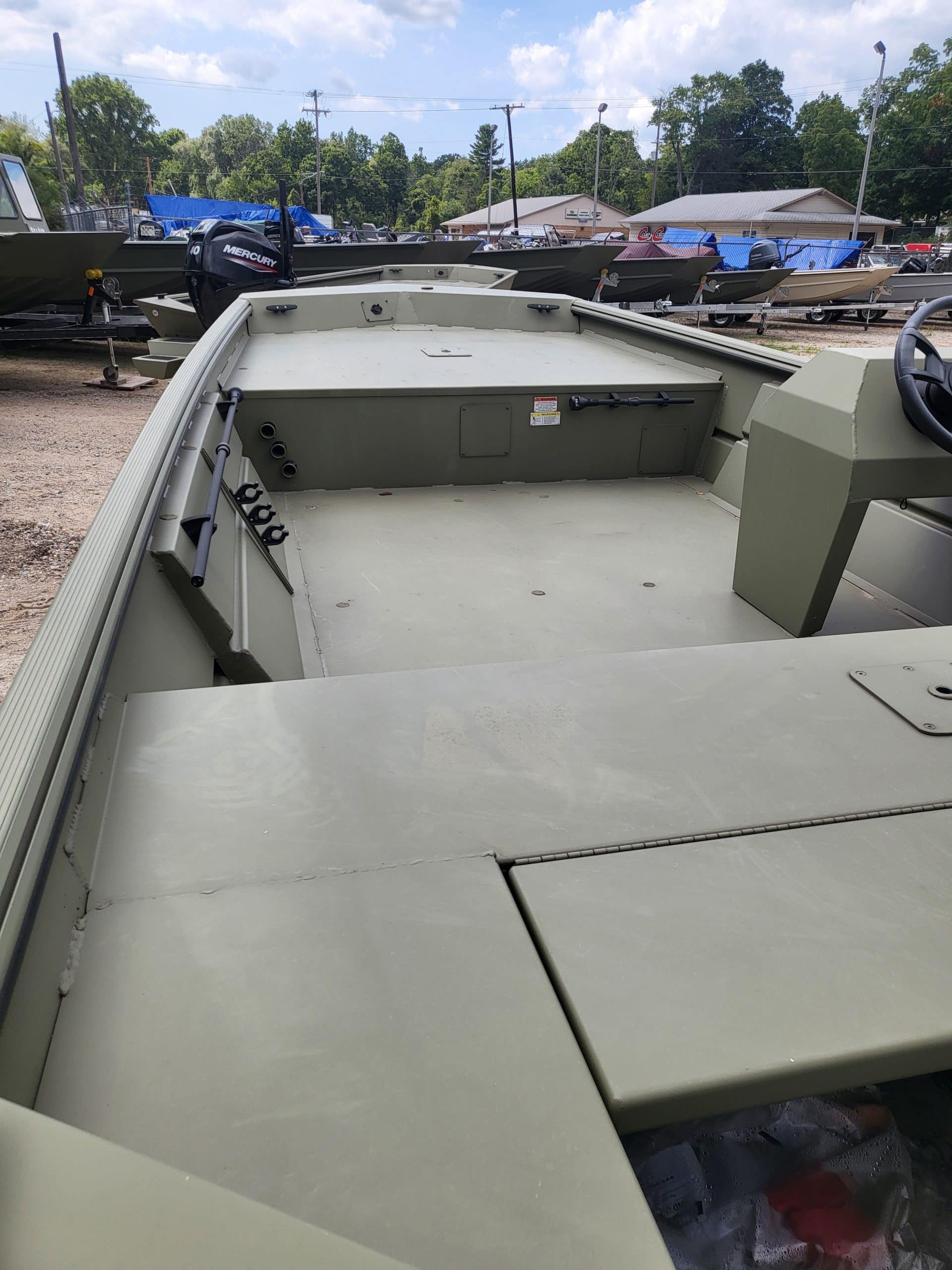 Lowe Boats RX1760 fishing boat interior with storage and controls.