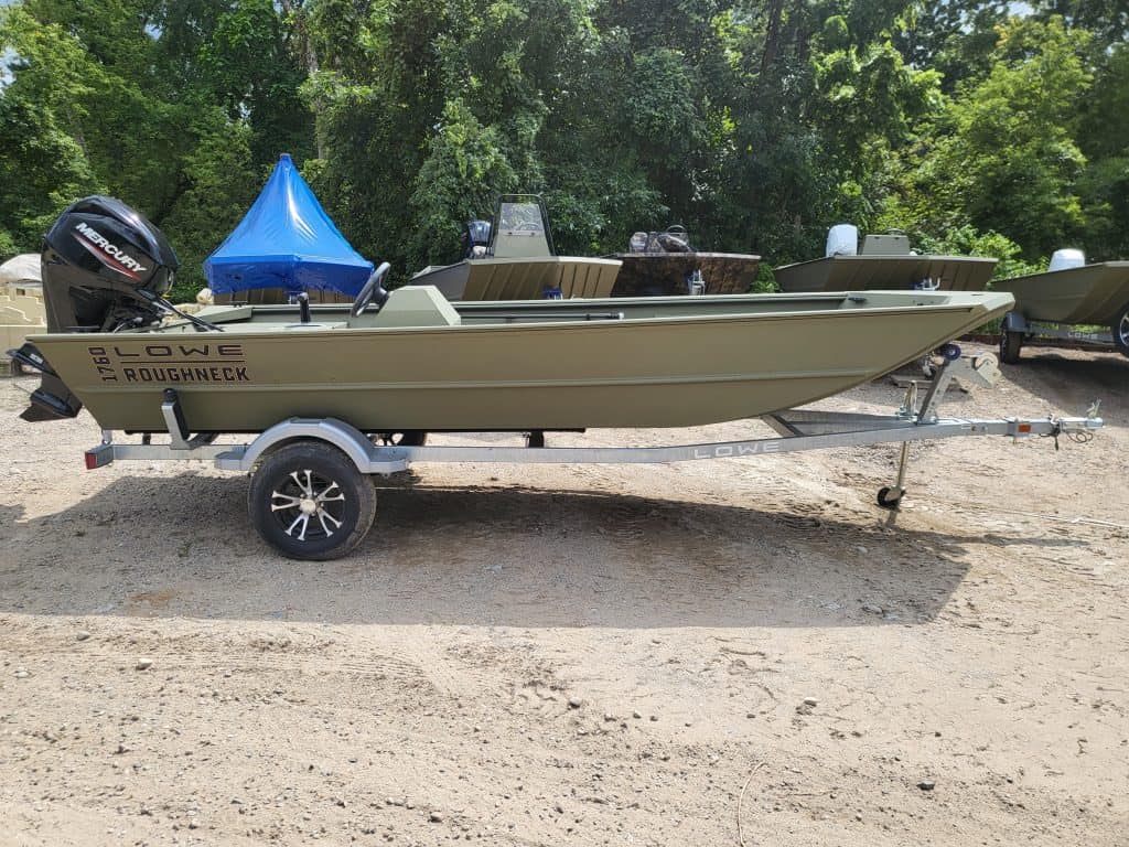 Lowe Boats RX1760 aluminum fishing boat on trailer with outboard motor.