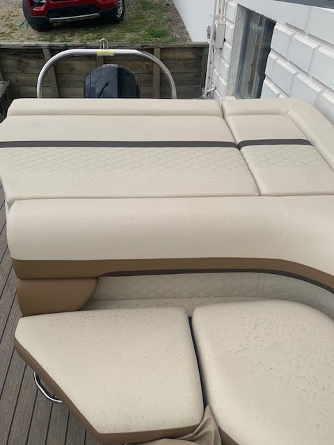 Comfortable boat seating with beige cushions on Lowe SS 210 model.