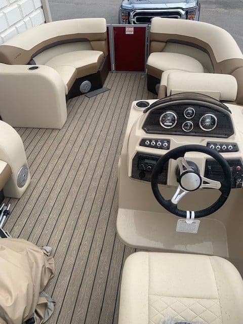 Interior of Lowe Boats SS 210 with steering wheel and seating.