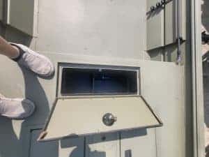 Open electrical panel access door on a utility box.
