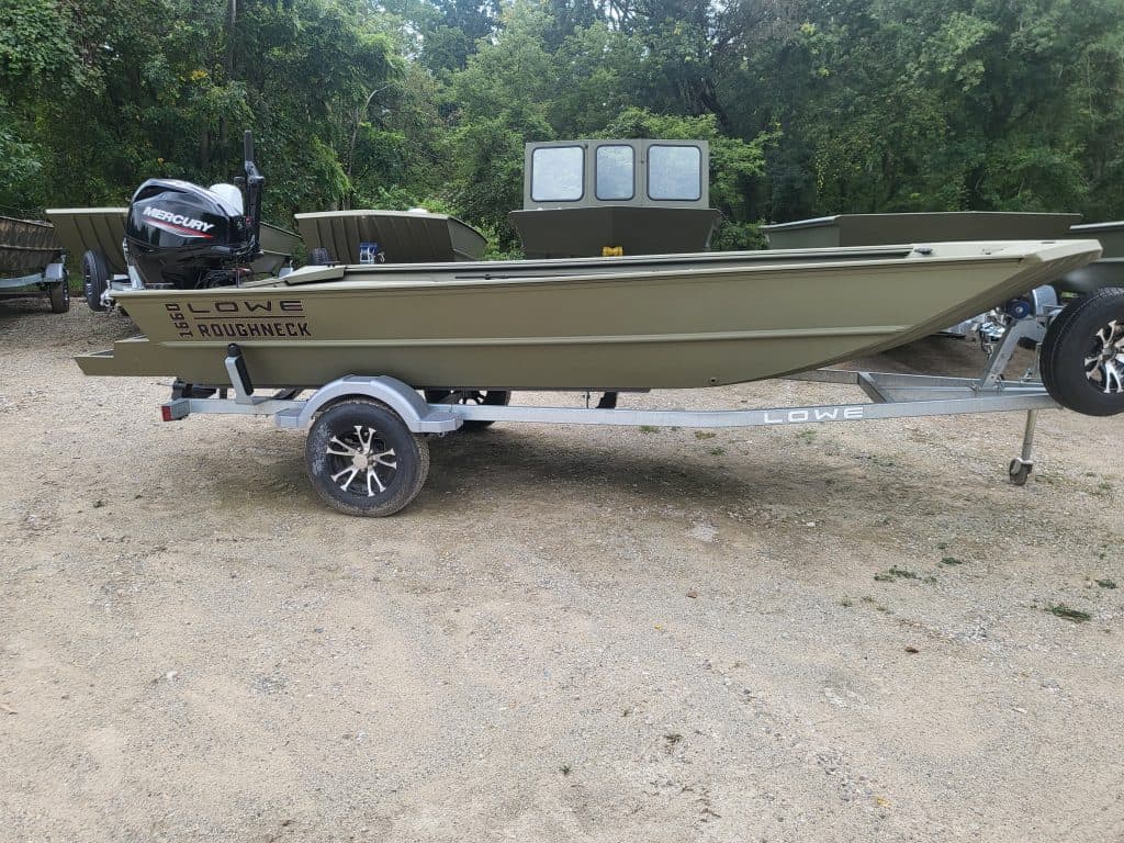 Lowe Boats RX 1660 fishing boat on trailer with outboard motor.