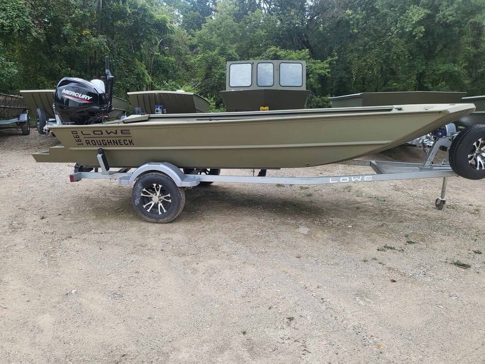 Lowe Boats RX 1660 fishing boat on trailer in outdoor setting.