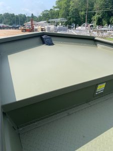 Close-up of the bow of a SeaArk 1660 MVT boat at a marina.