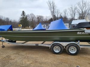 SeaArk 2472-MVT boat on trailer at Camp and Cruise.