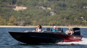 SeaArk Easy 200 boat with three passengers on a lake.