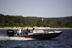 SeaArk Easy 200 boat cruising on water with three passengers.
