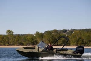 2023 SeaArk Protege boat cruising on water with outboard motor.