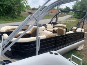 Lowe Boats SS230W pontoon boat with beige interior and black exterior.