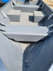 Bow area of Starcraft Alaskan 13 TL DLX boat with seating and storage.