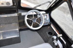 Boat cockpit with steering wheel and control panel for Thunder Jet 205 Rush.
