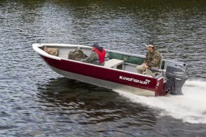 KingFisher 1825 Warrior Tiller boat on water with two people onboard.