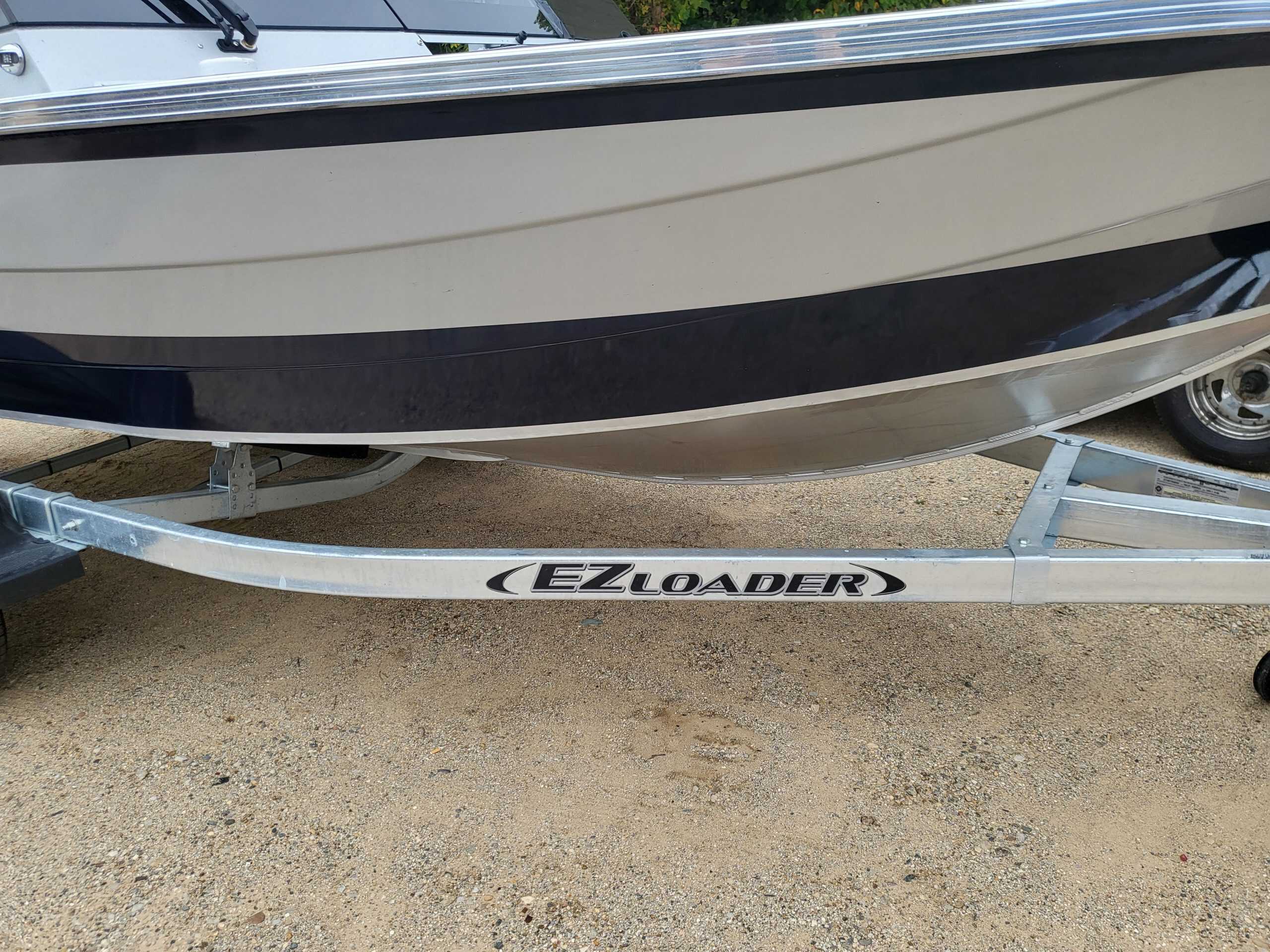 New 2024 KingFisher 1925 Arrow Sport boat on EZ Loader trailer.