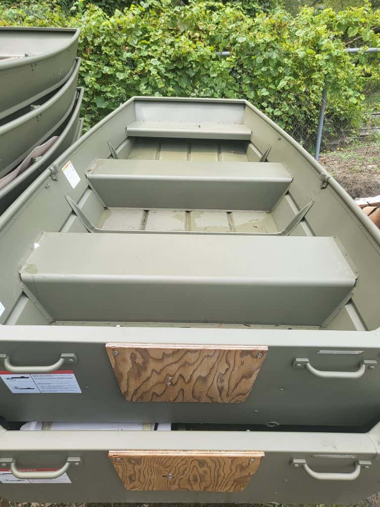 Durable aluminum boat with multiple compartments for fishing or recreation.