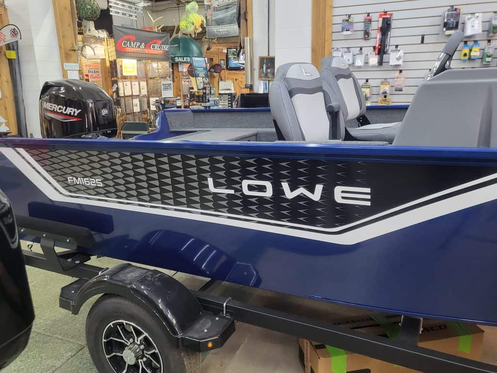 Lowe FM162S boat with Mercury outboard motor on display.