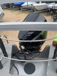 Lowe SD 224 boat with Mercury outboard motor at marina.