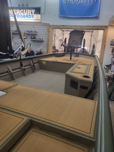 Interior view of SeaArk 1660 MVT bass boat with fishing deck and console.