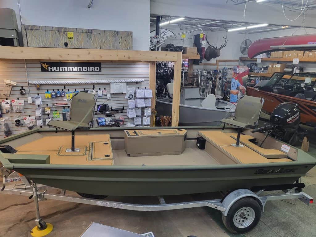 Fishing boat on trailer at Camp and Cruise store.
