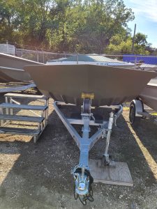 Boat trailer displayed outdoors, ready for watercraft transportation at Camp & Cruise.