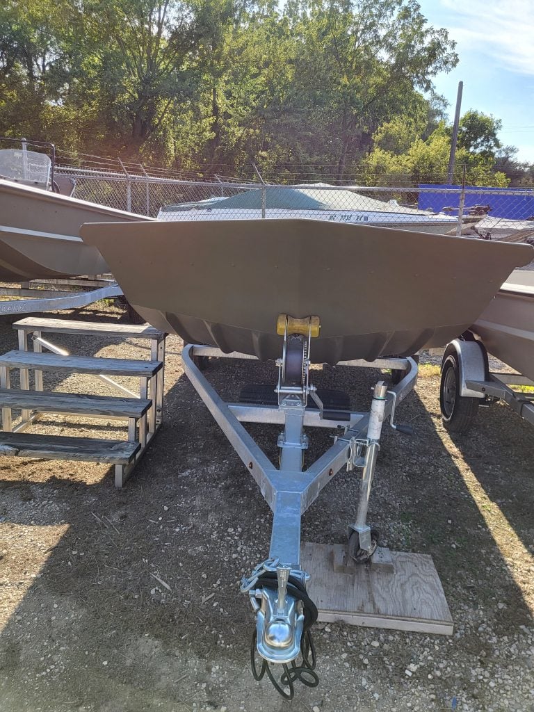 Boat trailer displayed outdoors, ready for watercraft transportation at Camp & Cruise.