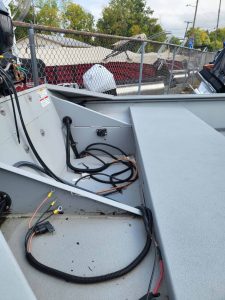 Close-up of boat interior with wiring and equipment, SeaArk 1860-JT model 2024.