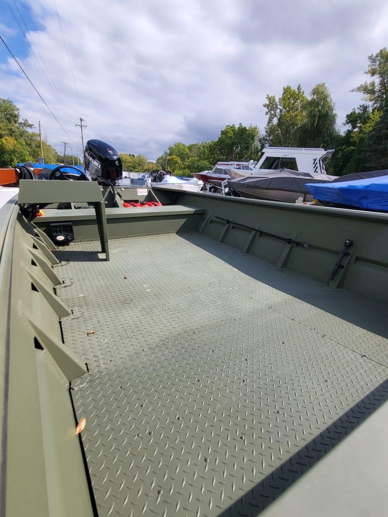 Marina boat deck with multiple boats and watercraft at Camp & Cruise, perfect for boating enthusiasts.