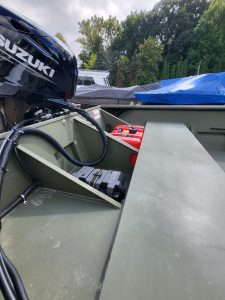Outboard motor and fuel system in a recreational boat at Camp & Cruise.