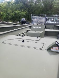 New SeaArk 1872 JTCC boat with outboard motor and safety rails.