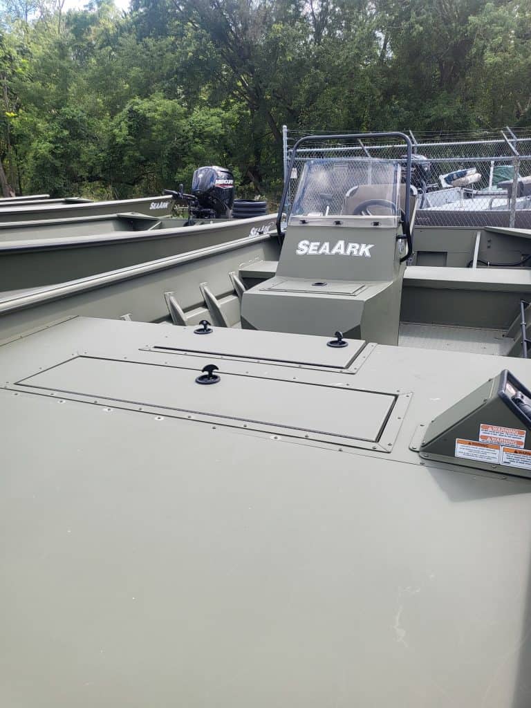 New SeaArk 1872 JTCC boat with outboard motor and safety rails.