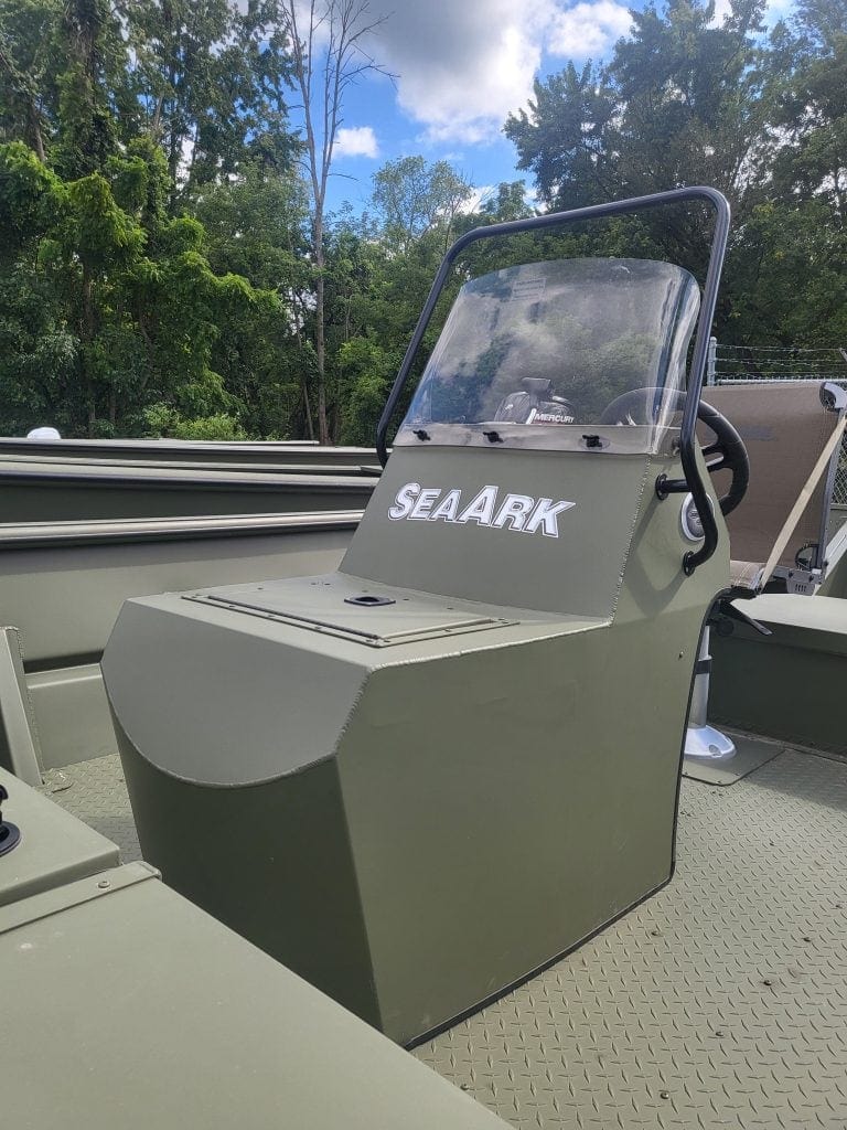 Boat console with SeaArk logo and windshield on a fishing boat.