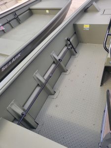 Close-up of the interior of a SeaArk 1872 JTCC boat showing the floor and side rails.