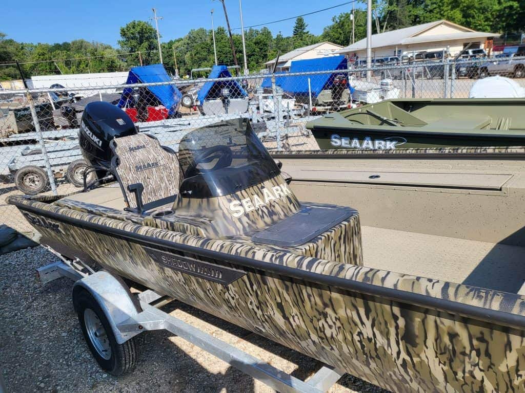 SeaArk Shadow 18 SC fishing boat with outboard motor on trailer.