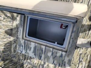 Storage compartment on SeaArk Shadow 18J CC boat for secure gear storage.