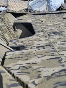 Close-up of the camo-patterned boat deck on a SeaArk Shadow 18J CC.