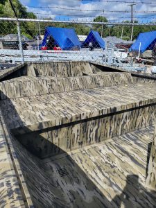 Camouflage boat seating with tiered design at Camp and Cruise.