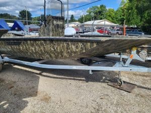 Camouflage SeaArk Shadow 18J CC fishing boat on trailer.