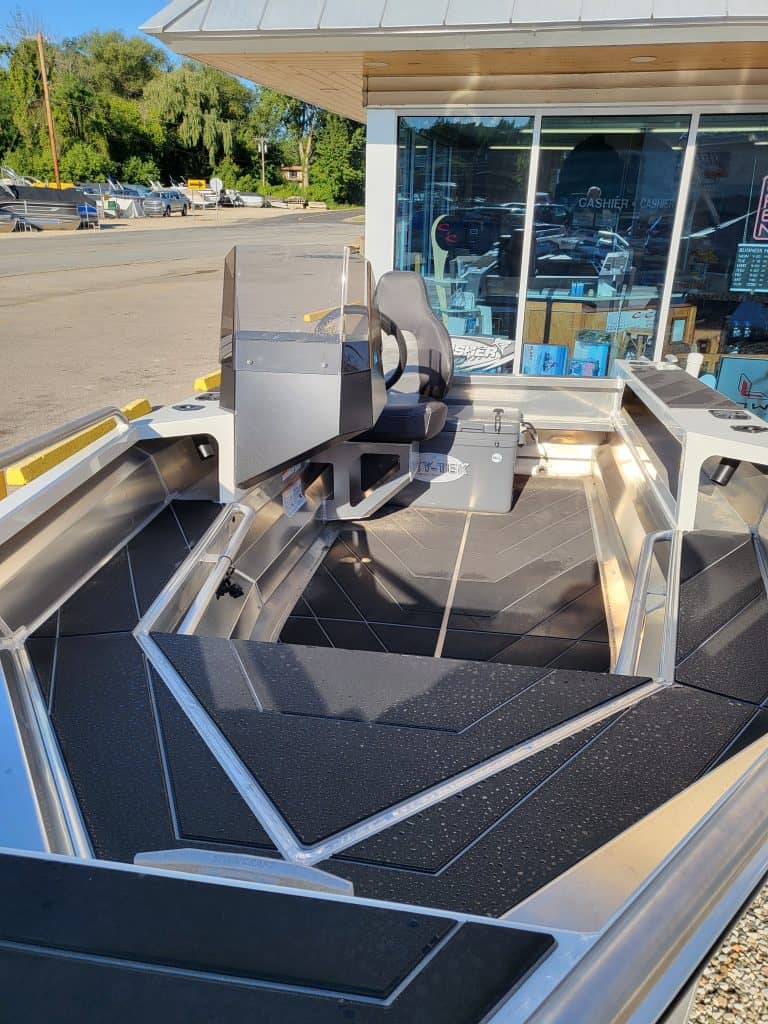 Fishing boat featuring ample tackle storage and a comfortable seat, perfect for fishing adventures.