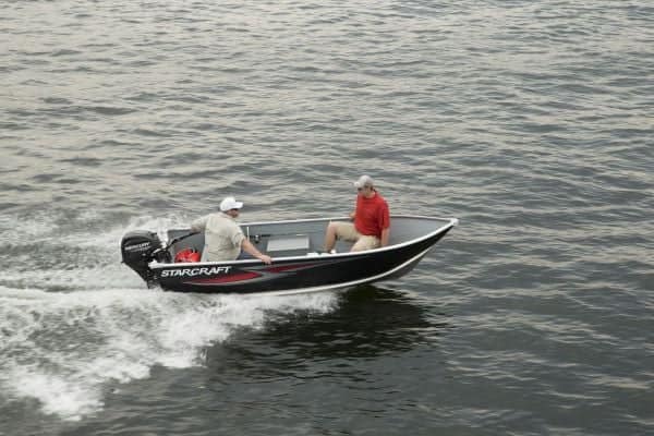 Starcraft Alaskan 13 boat with two people on the water.