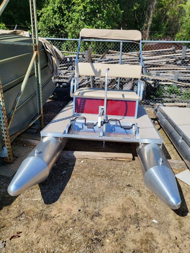 Paddle King PK3000 pontoon boat with seating and pontoons.