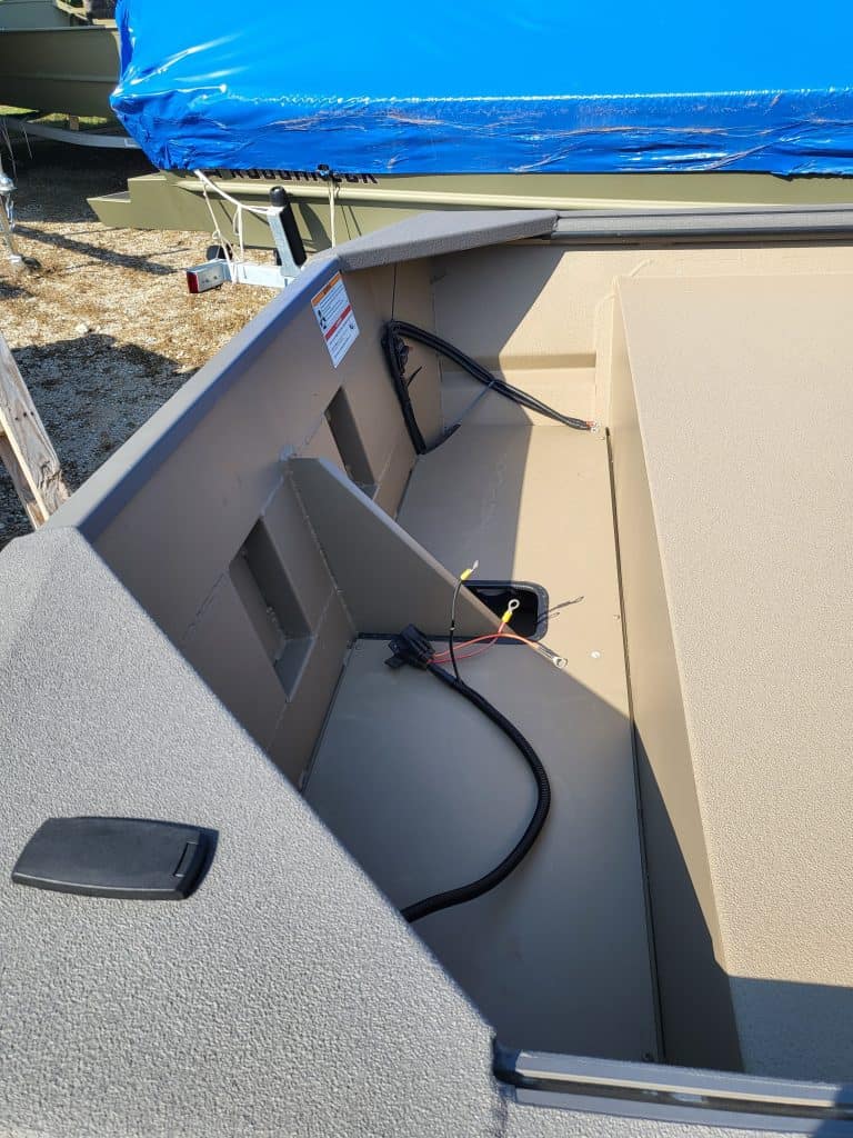 Boat interior with wiring and storage area for SeaArk 1548-DXS DKLD.