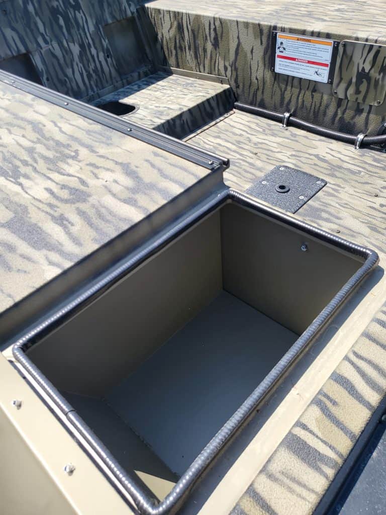 Storage compartment on SeaArk 1652-DXS-SLD boat for fishing gear.