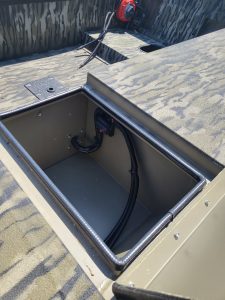 Close-up of boat storage compartment with wiring for SeaArk 1652-DXS-SLD.