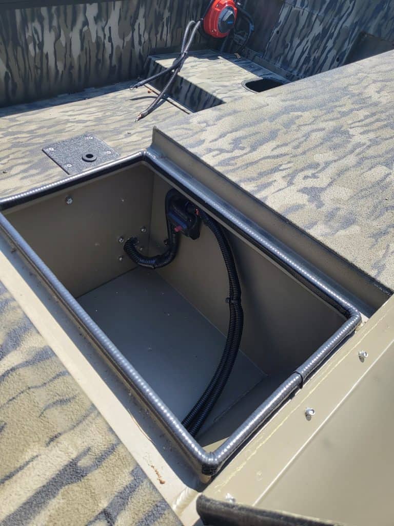 Close-up of boat storage compartment with wiring for SeaArk 1652-DXS-SLD.