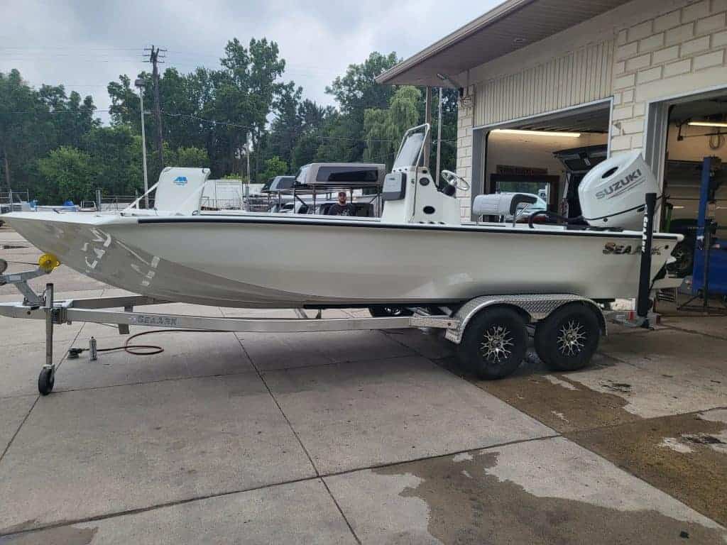 New SeaArk BayRunner Tunnel 210 boat with Suzuki outboard motor.