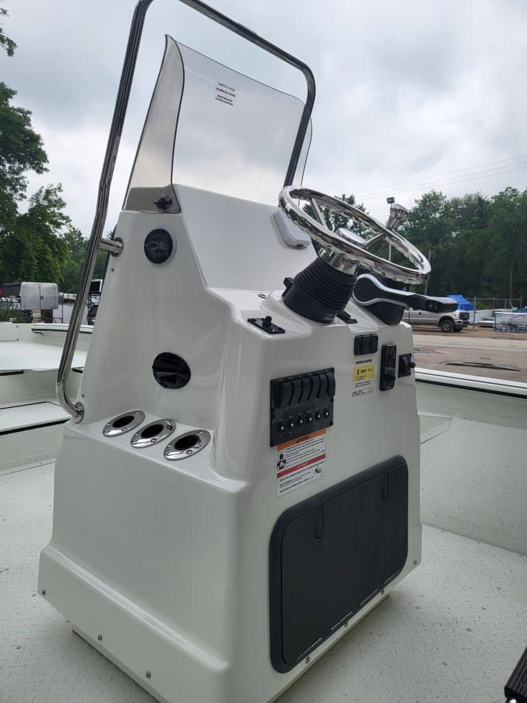 Boat helm console with steering wheel and controls for SeaArk BayRunner Tunnel 210.