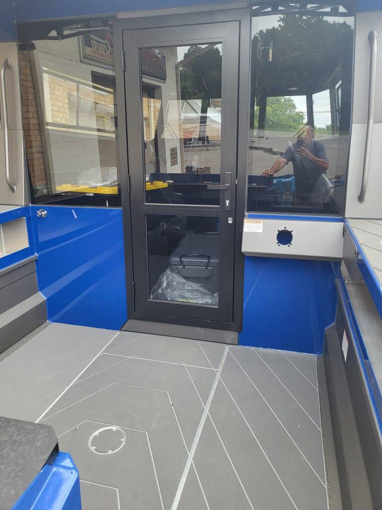 Close-up of the walk-through door on the StabiCraft 2250 UltraCab boat.