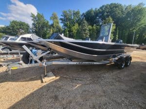 Black and white boat on trailer at Camp and Cruise.