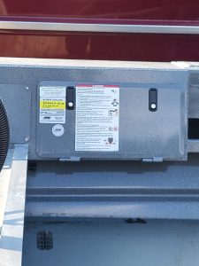 Close-up of boat's warning and instruction labels on the center console.
