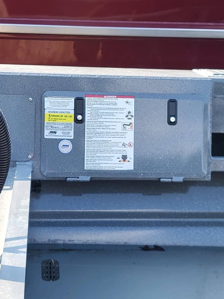 Close-up of boat's warning and instruction labels on the center console.