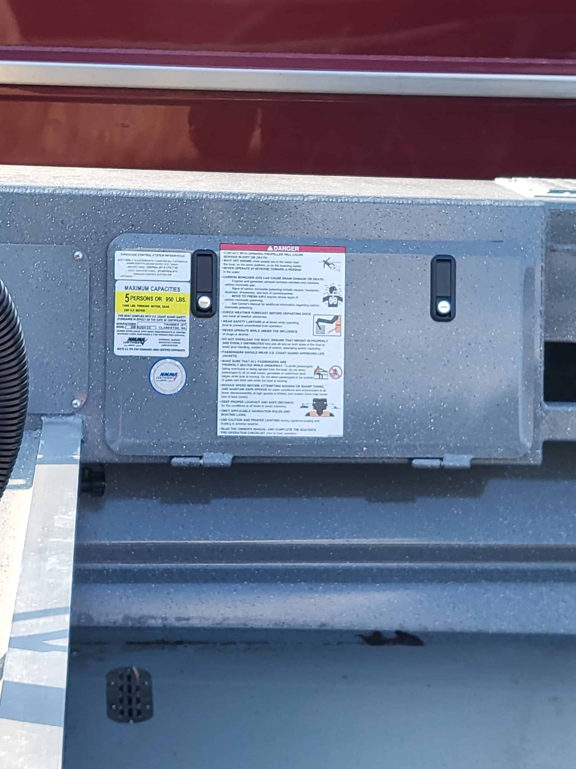 Close-up of boat's warning and instruction labels on the center console.